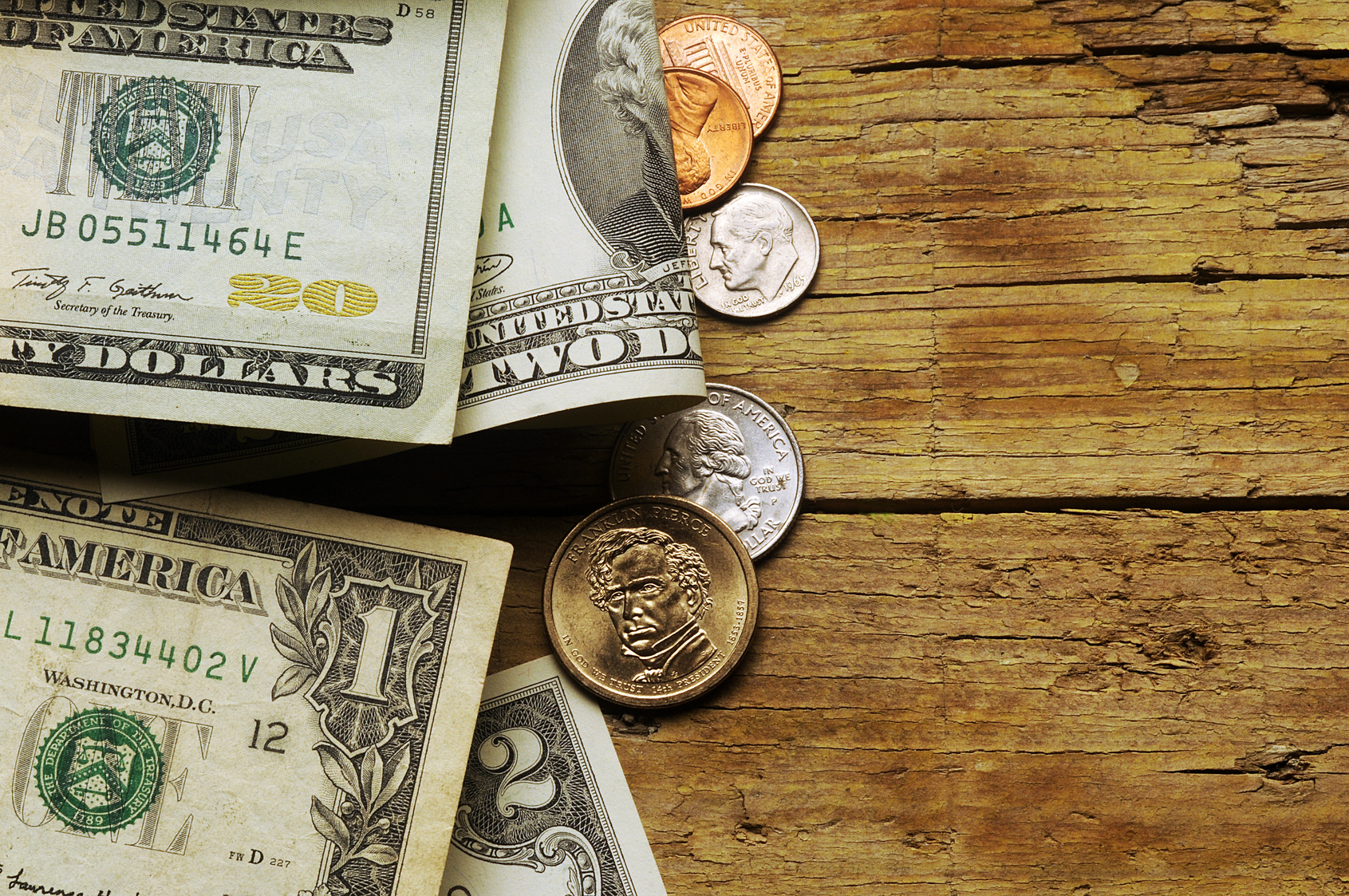 American currency on a rustic wood background