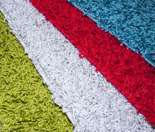 Different colors of carpet including red, white, blue, and green