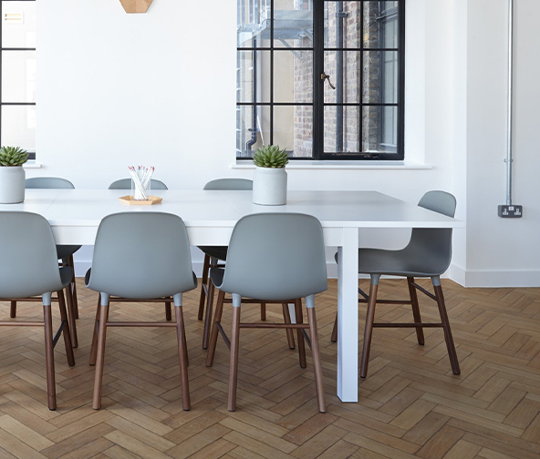 Herringbone wood look tile in modern dining space