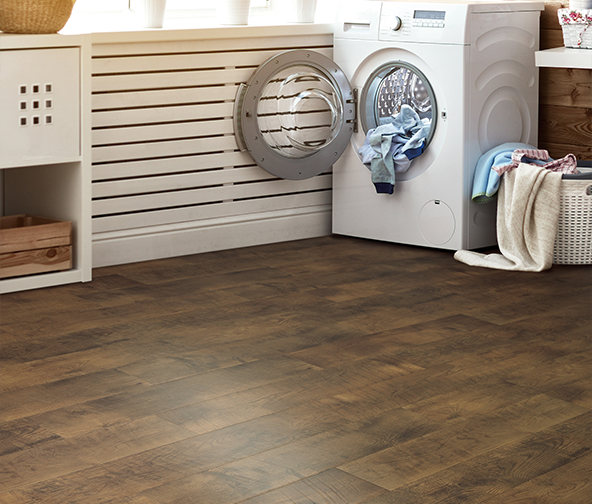 Laundry room with beautiful wood look laminate flooring