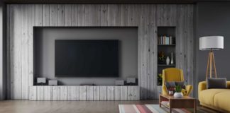 Television surround with sleek gray wood paneling