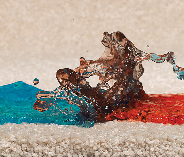 Multi color drinks spilling on protected carpeting