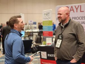 Sam Locher (left) of A.J. Rose and USA Flooring’s Fred Black all smiles at the NFA showcase